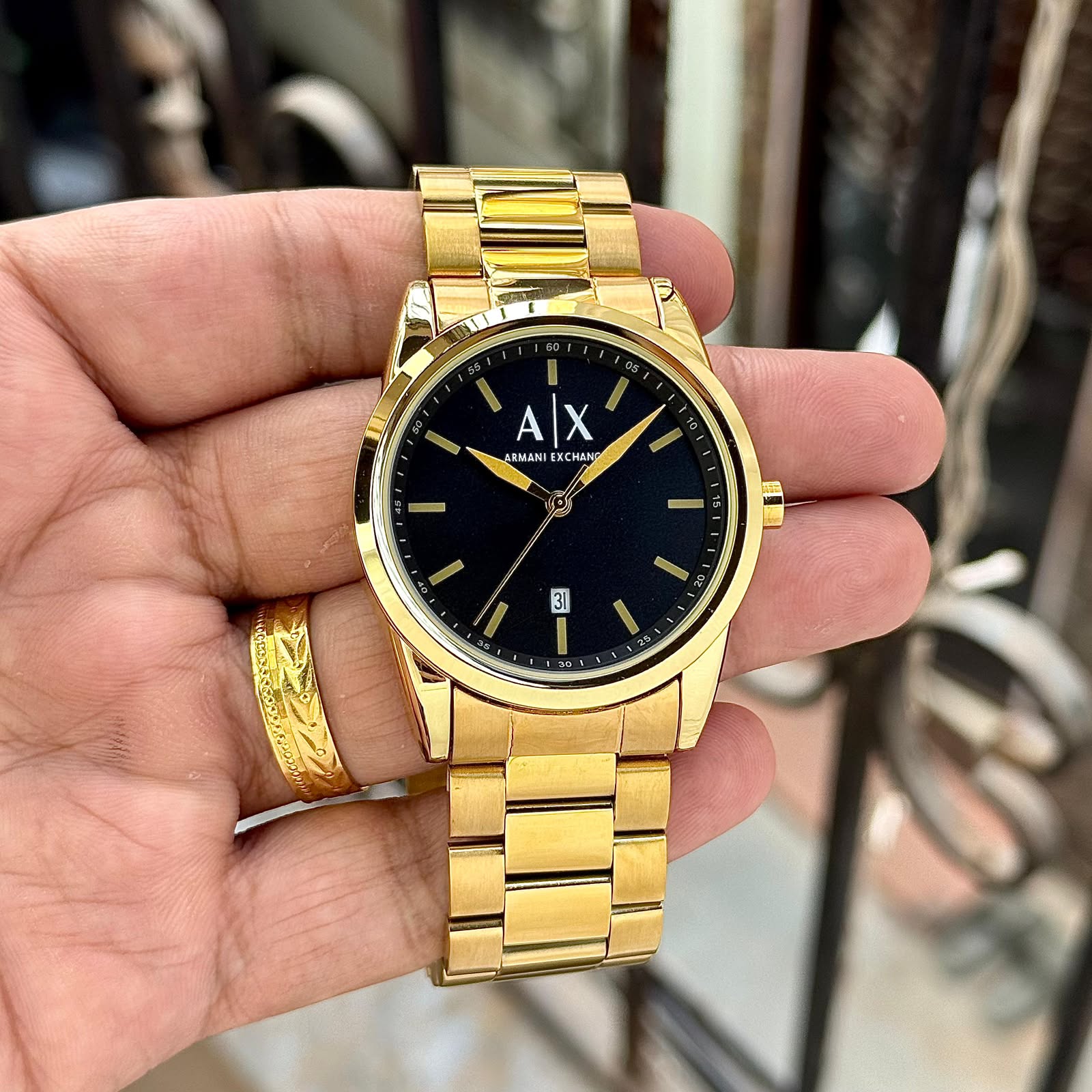 ARMANI EXCHANGE GOLD-TONE β SIGNATURE BLACK DIAL EDITION